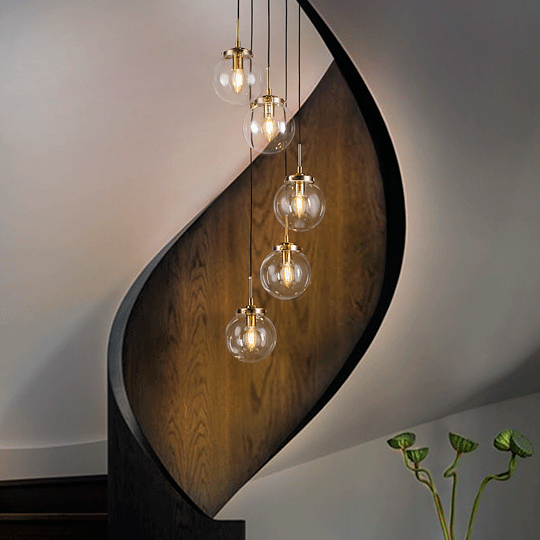 Contemporary Staircase Chandelier in Antique Brass with Glass Globes