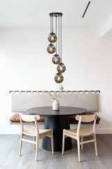 5-Light Modern Matte Black Staircase Chandelier with Smoke Globe Bubble Glass Corner Pendant