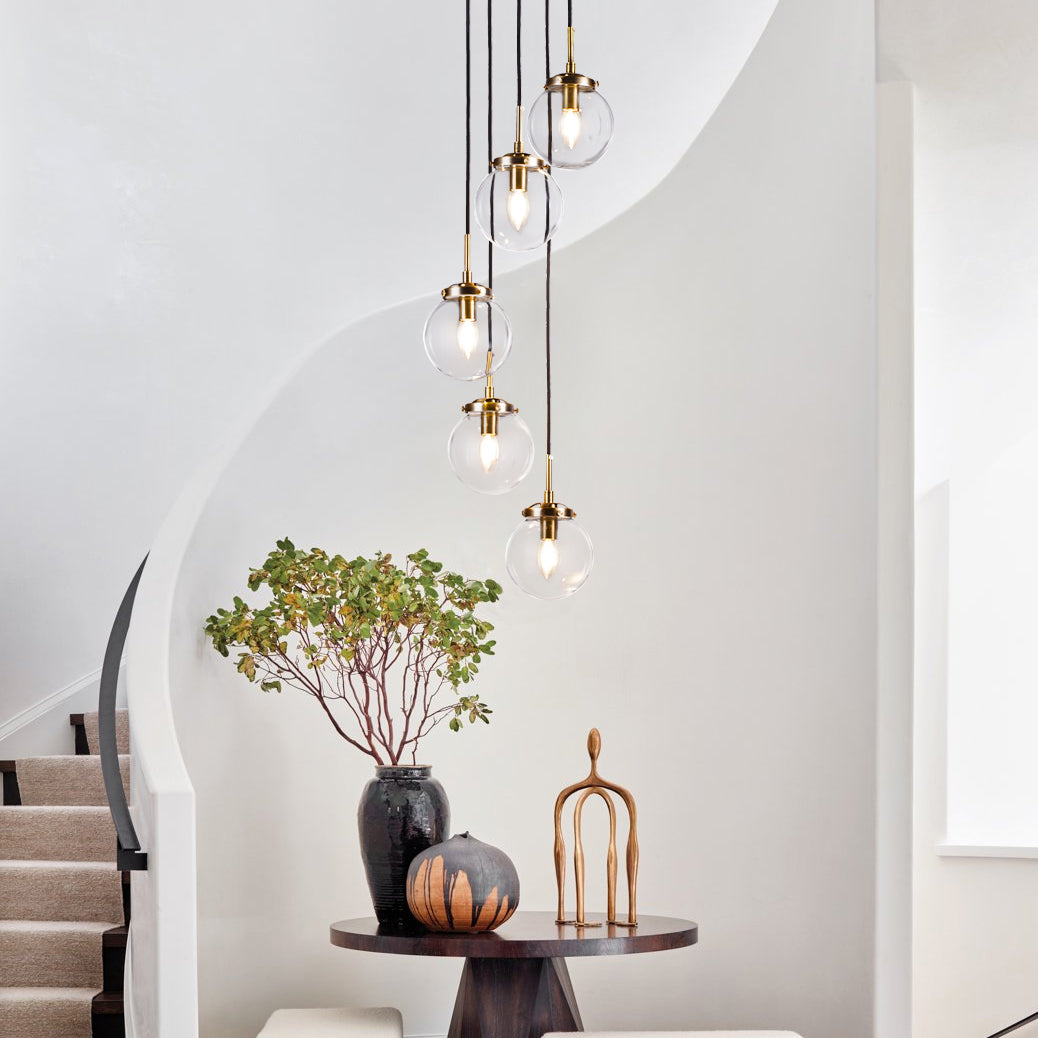 Contemporary Staircase Chandelier in Antique Brass with Glass Globes